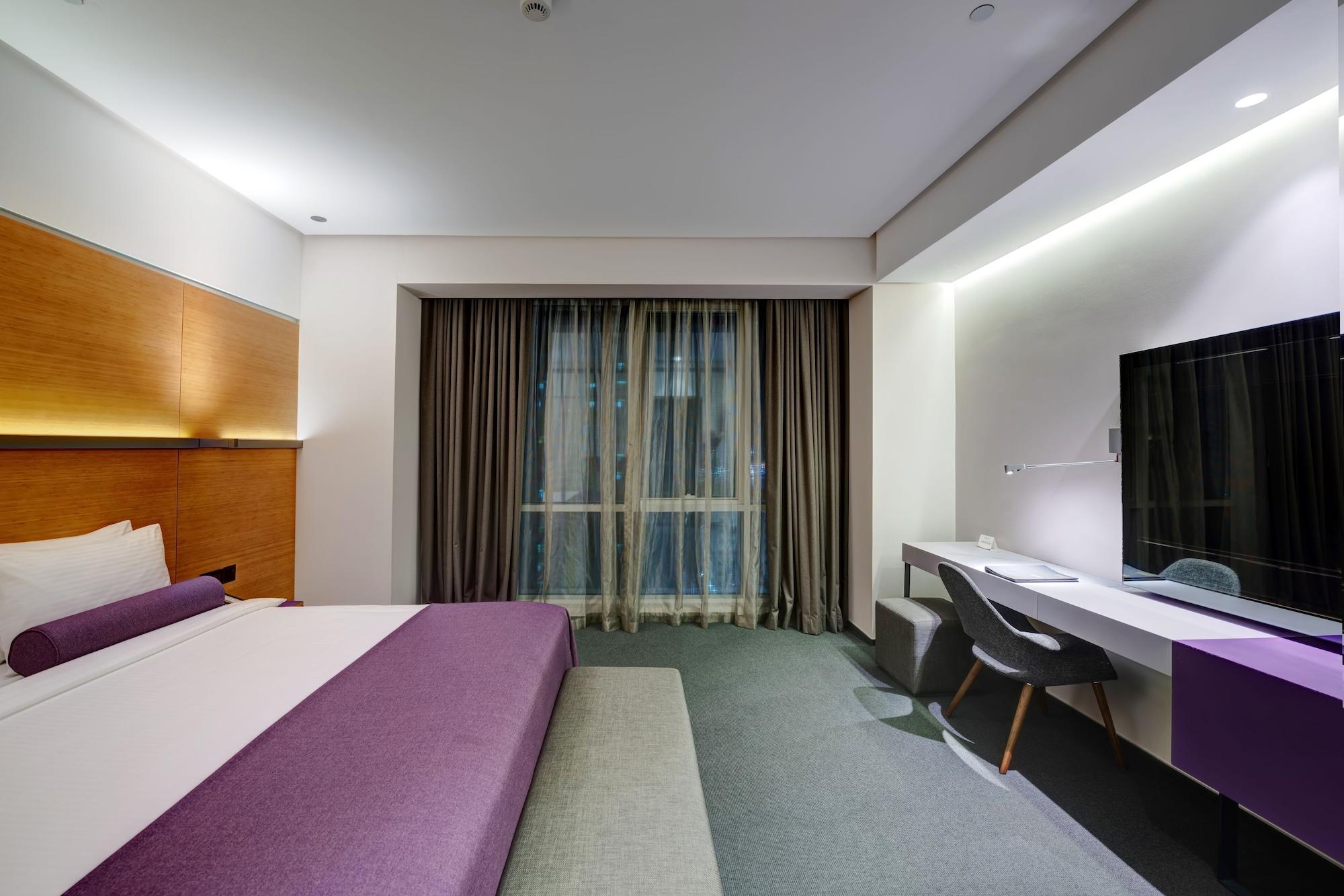 The Act Hotel Шарджа Екстер'єр фото A room at the hotel